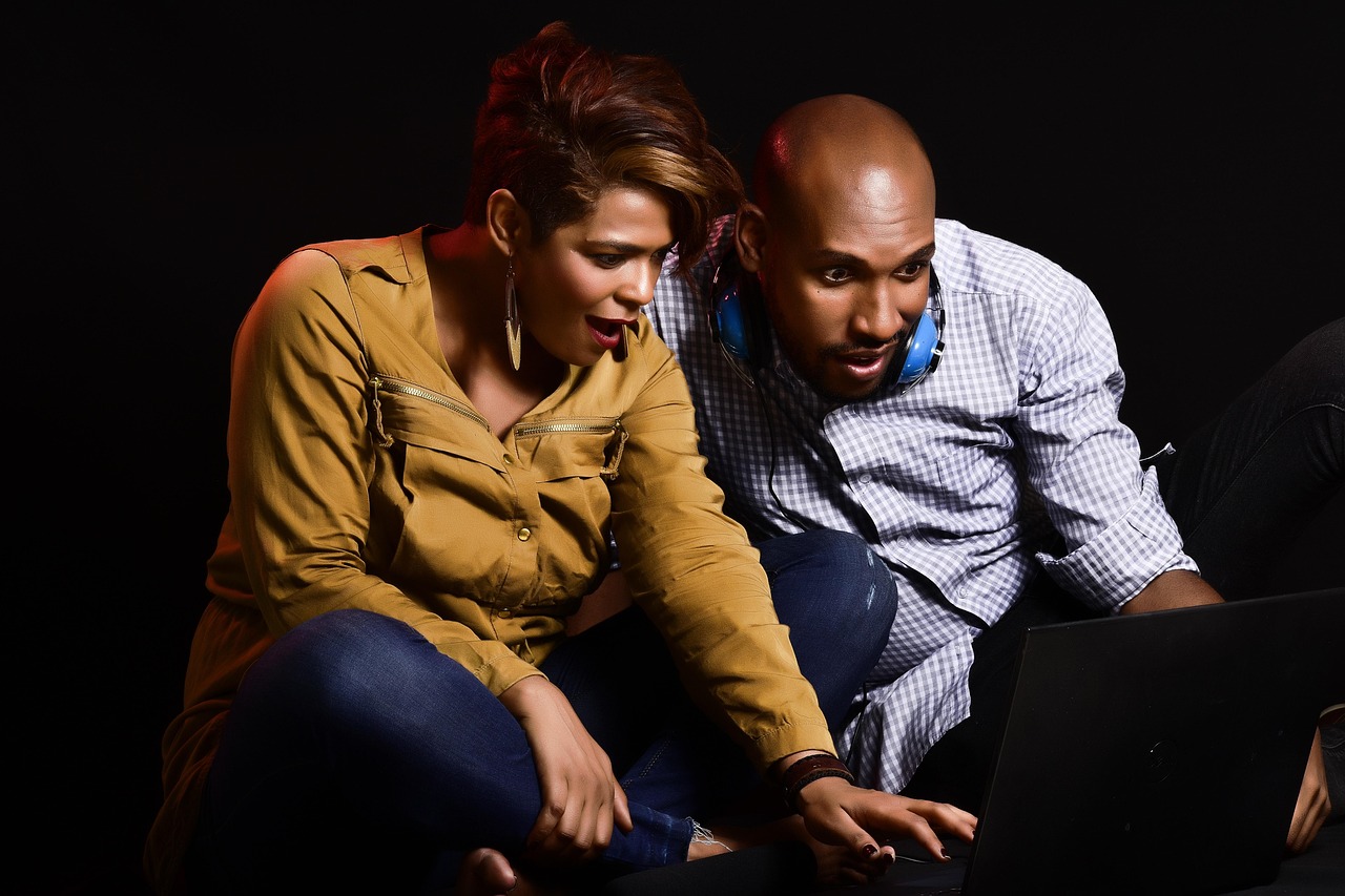 adult, couple, woman, man, fun, enjoyment, notebook, media, watching tv, astonished, surprised, black people, black laptop, black watch, black media, black surprise, black fun, watching tv, watching t