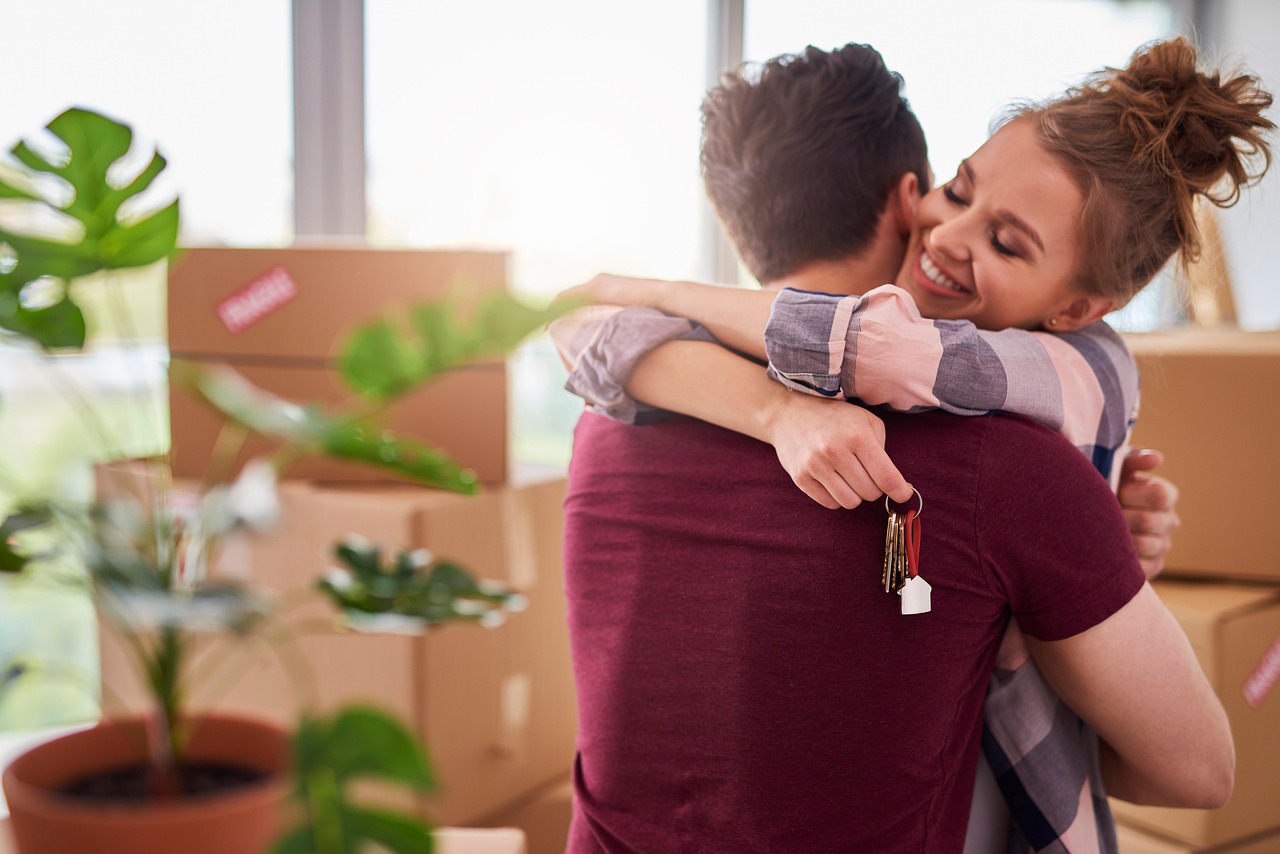 Couple outside their house