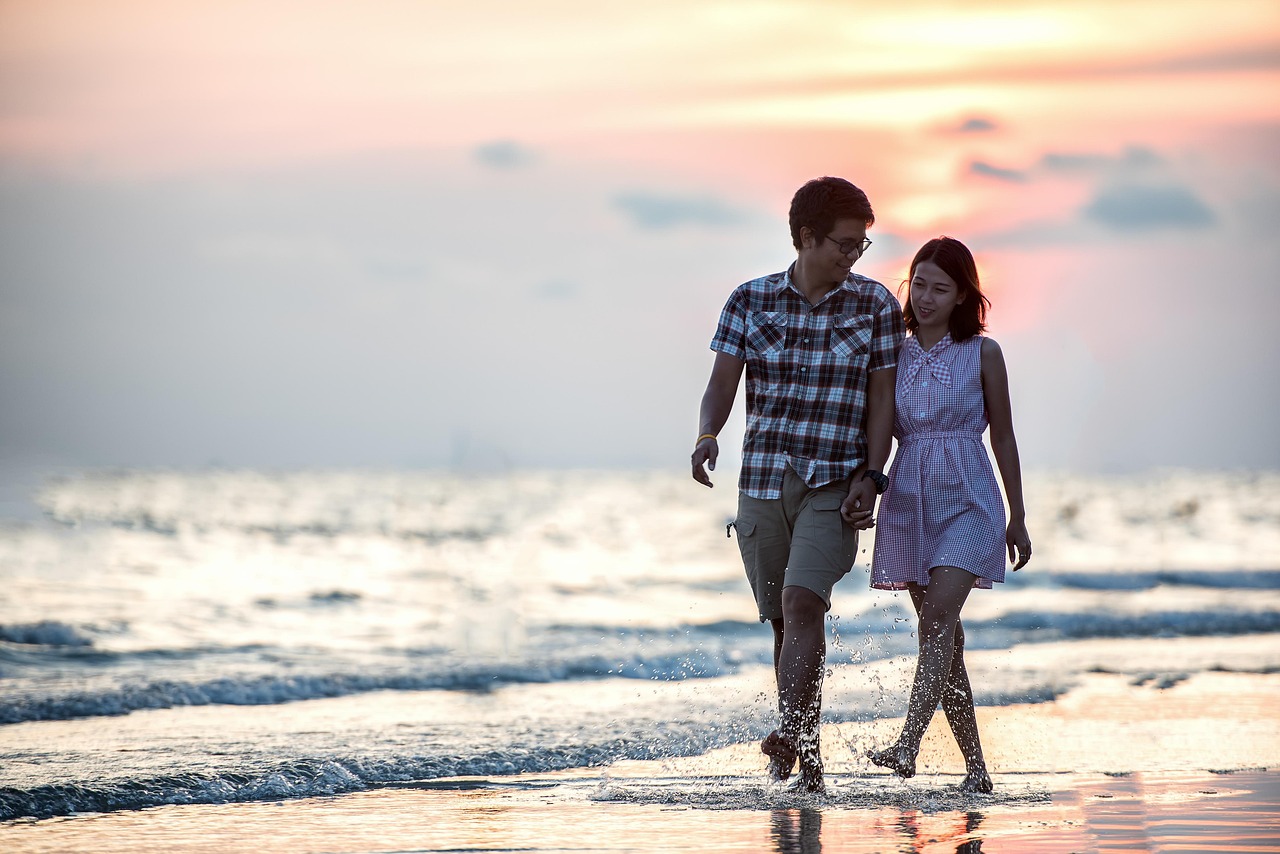 Couple walking at the beach