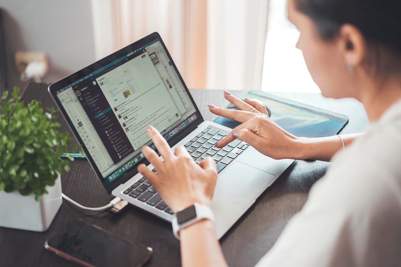 Woman working with a laptop in an office