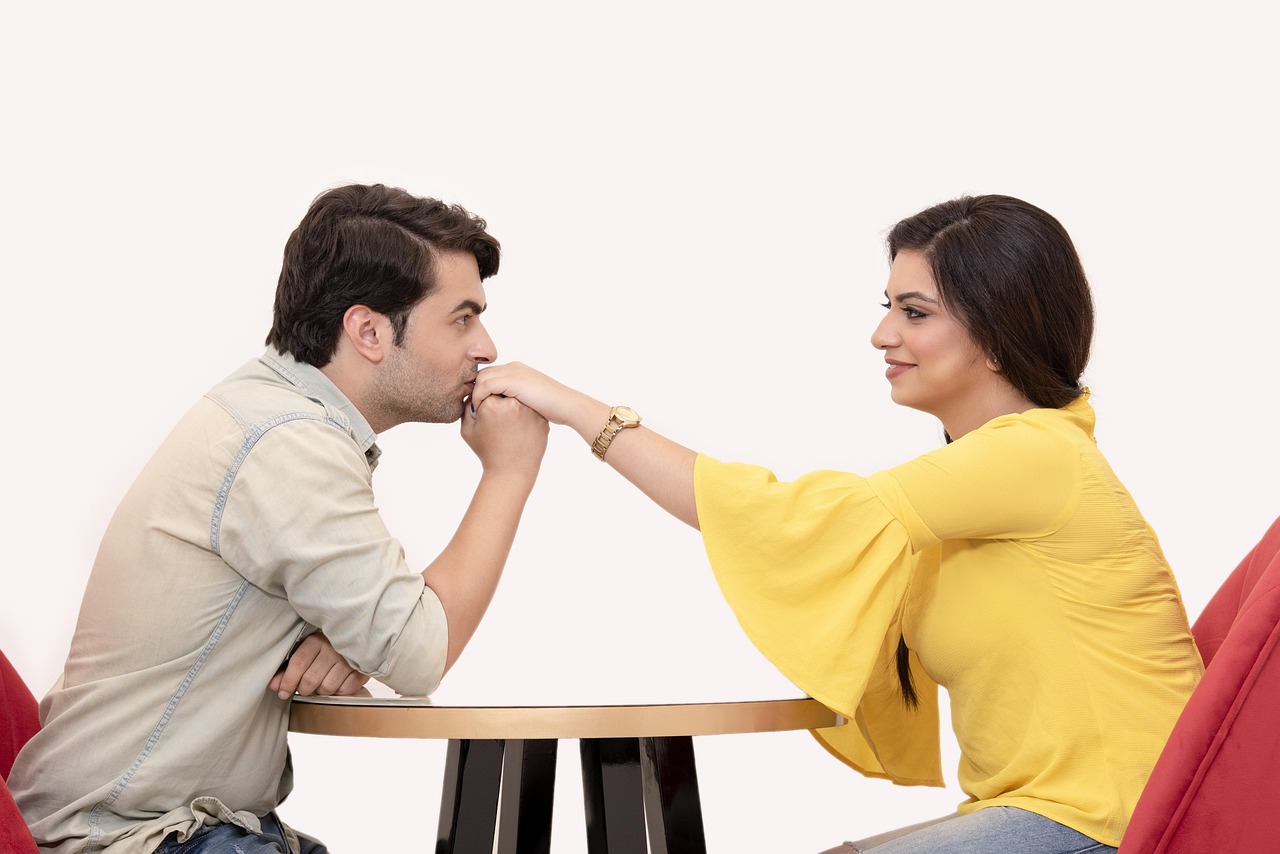 Couple dating with a laptop at the table