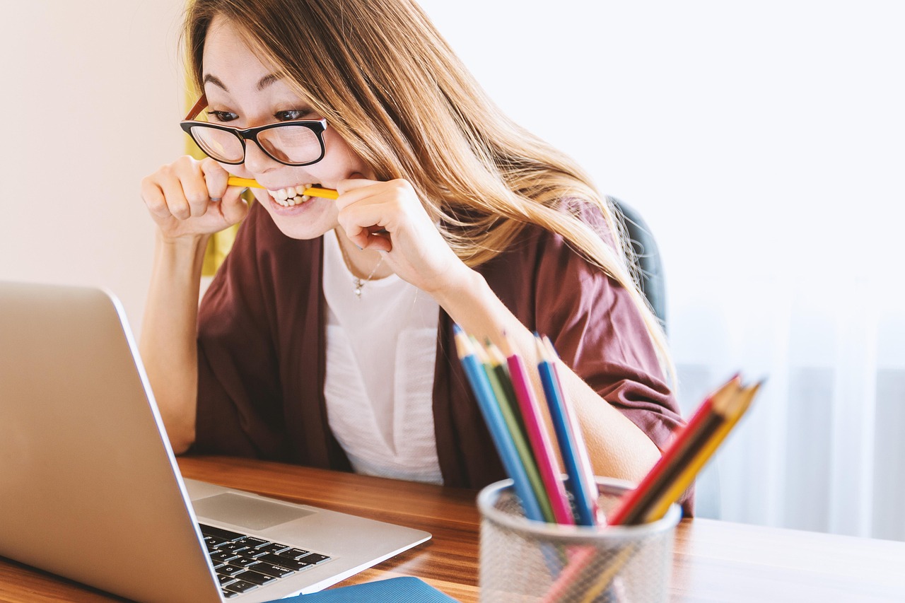 Woman studying with a laptop in an office